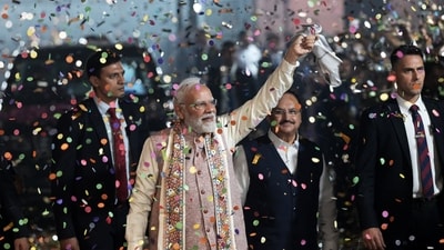 Indian Prime Minister Narendra Modi showered with confetti on his arrival at the headquarters of the Bhartiya Janata Party in New Delhi after the National Democratic Alliance led by his party headed toward a landslide victory in the Bihar (AP) Indian Prime Minister Narendra Modi showered with confetti on his arrival at the headquarters of the Bhartiya Janata Party in New Delhi after the National Democratic Alliance led by his party headed toward a landslide victory in the Bihar (AP)