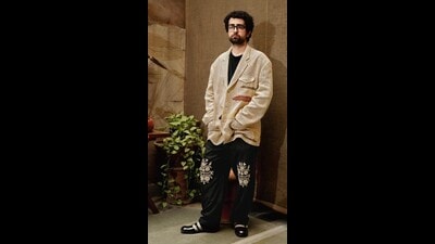 Kumra in embroidered pants from Kartik Research’s Fauji collection, and a coat designed by his idol, the Japanese designer Yohji Yamamoto. (Abhishek Khedekar) Kumra in embroidered pants from Kartik Research’s Fauji collection, and a coat designed by his idol, the Japanese designer Yohji Yamamoto. (Abhishek Khedekar)