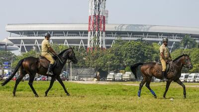 Police personnel keep watch outside the Eden Gardens on the first day of first Test between India and South Africa on Friday. (PTI) Police personnel keep watch outside the Eden Gardens on the first day of first Test between India and South Africa on Friday. (PTI)