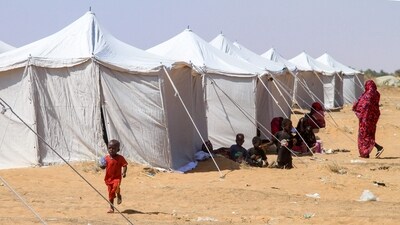 Children from El-Fasher rest outside their tent at a camp for displaced Sudanese people. (AFP) Children from El-Fasher rest outside their tent at a camp for displaced Sudanese people. (AFP)