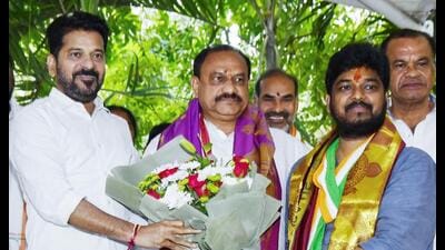 Telangana Chief Minister A. Revanth Reddy greets winner of the Jubilee Hills by-election Naveen Yadav before addressing the media, in Hyderabad on Friday. (ANI)