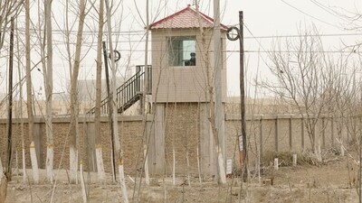 China's Xinjiang: A security guard watches from a tower around a detention facility in Yarkent County in northwestern China's Xinjiang. (File photo). (AP) China's Xinjiang: A security guard watches from a tower around a detention facility in Yarkent County in northwestern China's Xinjiang. (File photo). (AP)