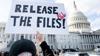 A protester holds a sign related to the release of the Jeffrey Epstein case files outside the U.S. Capitol on Wednesday. A protester holds a sign related to the release of the Jeffrey Epstein case files outside the U.S. Capitol on Wednesday.