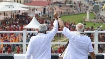 PM Modi raising Nitish Kumar's arm for the crowds, in a photo shared by the BJP. (X/@BJP4Bihar) PM Modi raising Nitish Kumar's arm for the crowds, in a photo shared by the BJP. (X/@BJP4Bihar)
