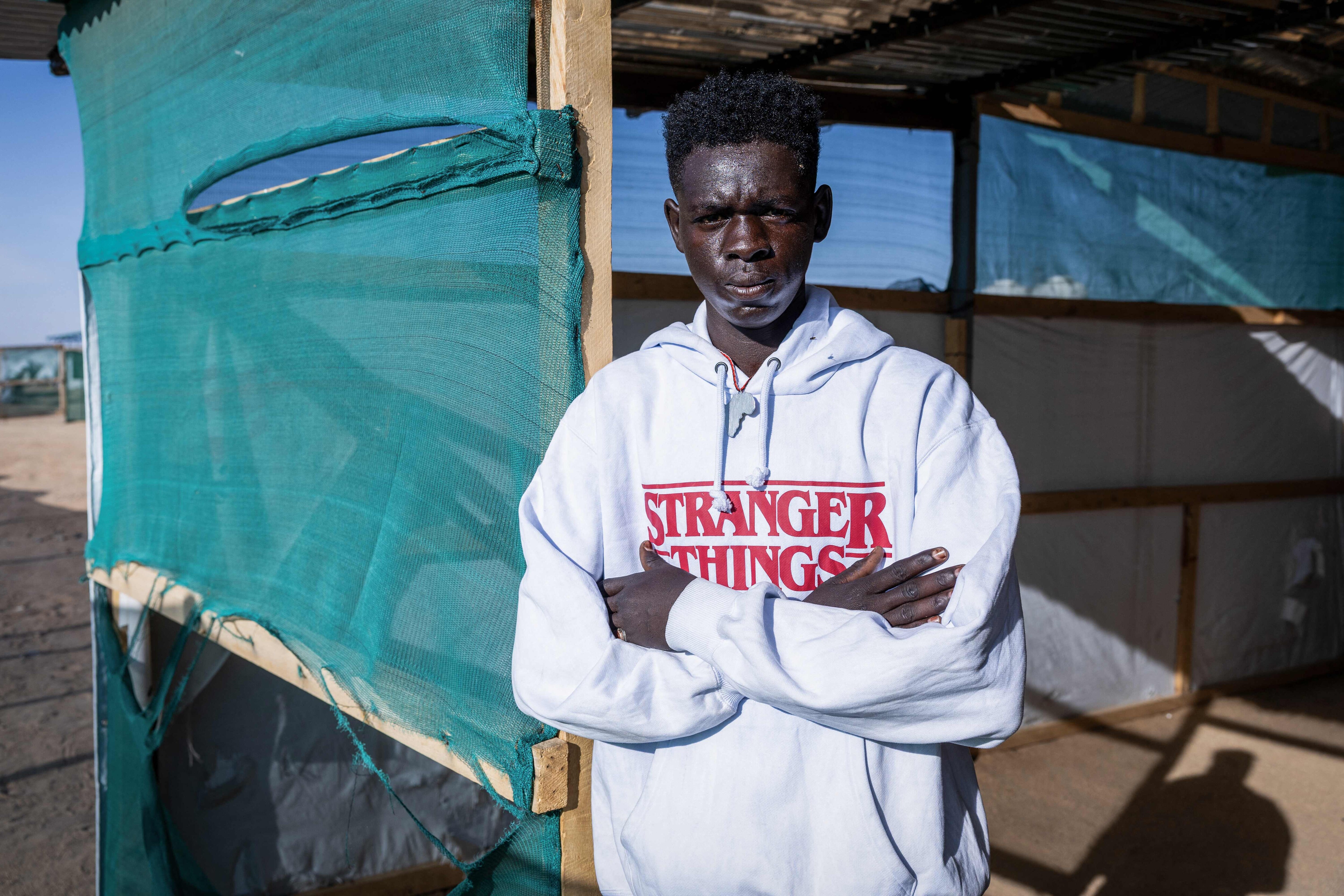 Mounir Abderahmane, 16, poses for a photograph at the Doctors Without Borders (MSF) clinic in the Tine transit camp in Chad. (AFP) Mounir Abderahmane, 16, poses for a photograph at the Doctors Without Borders (MSF) clinic in the Tine transit camp in Chad. (AFP)