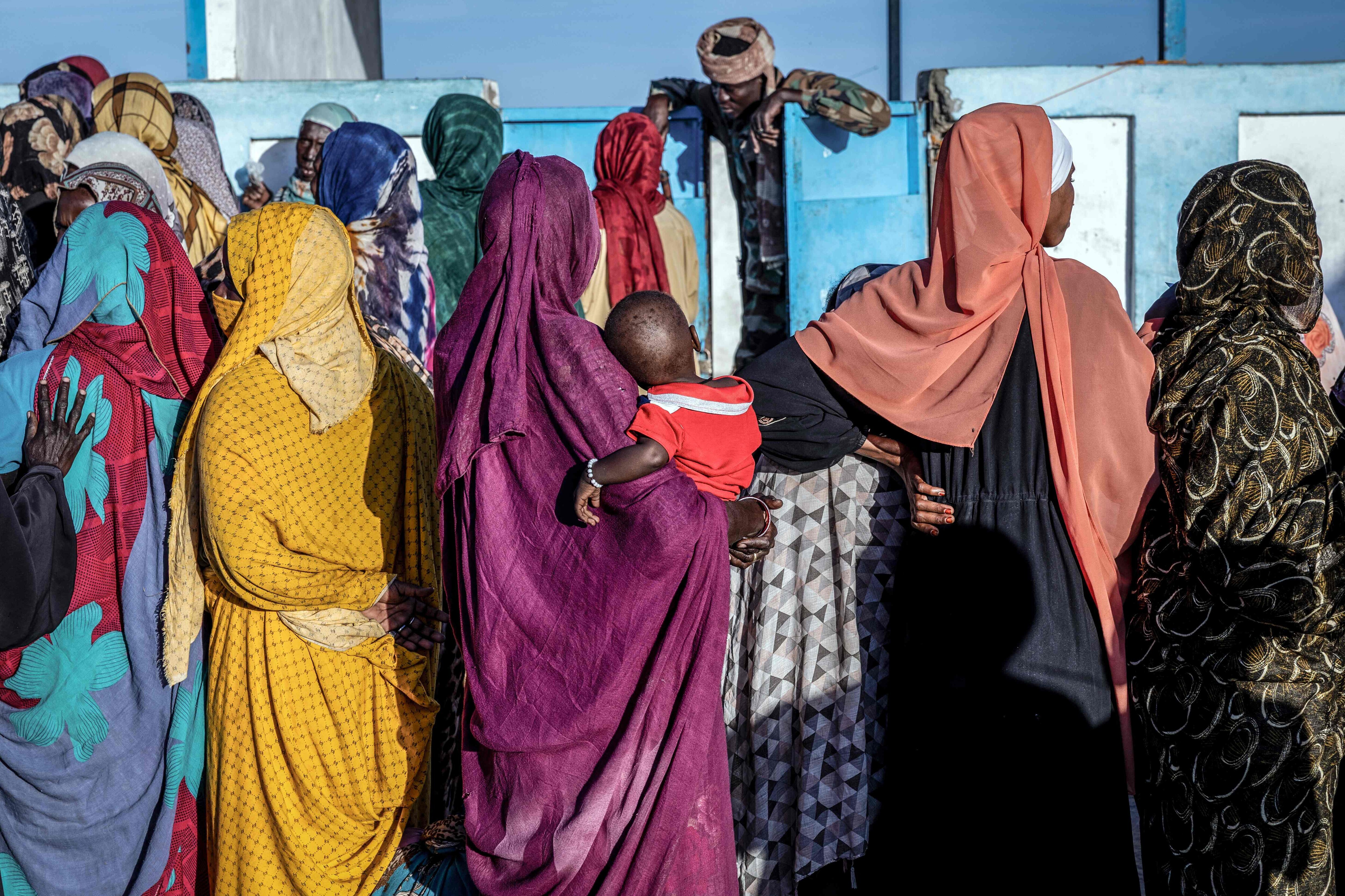 Sudanese refugees wait outside the United Nations High Commissioner for Refugees (UNHCR) registration office in the Tine transit camp in Chad. (AFP) Sudanese refugees wait outside the United Nations High Commissioner for Refugees (UNHCR) registration office in the Tine transit camp in Chad. (AFP)