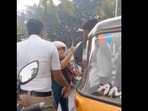 The clip shows a woman on a two-wheeler riding against the flow of traffic before colliding head-on with an autorickshaw.