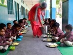 tudents of a primary government school having mid-day meal during school hours in Ludhiana (HT Photo)
