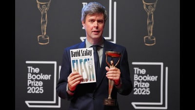 Hungarian-British author David Szalay poses for photographers with the trophy after winning the Booker Prize 2025 for his book 'Flesh' during a ceremony at Old Billingsgate in London on Monday, 10 November, 2025. (Kirsty Wigglesworth/AP) Hungarian-British author David Szalay poses for photographers with the trophy after winning the Booker Prize 2025 for his book 'Flesh' during a ceremony at Old Billingsgate in London on Monday, 10 November, 2025. (Kirsty Wigglesworth/AP)