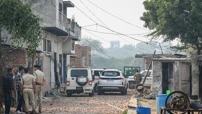 Faridabad: Police officials during a search and cordon operation linked to an interstate and transnational terror module, at Fatehpur Taga village (PTI) Faridabad: Police officials during a search and cordon operation linked to an interstate and transnational terror module, at Fatehpur Taga village (PTI)