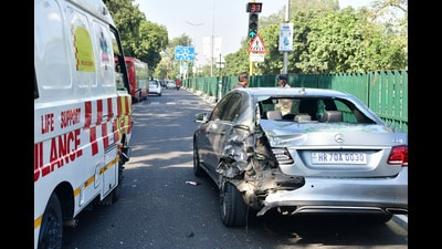 The damaged car and the ambulance near GMSH-16 in Chandigarh on Saturday. (RAVI KUMAR/HT)