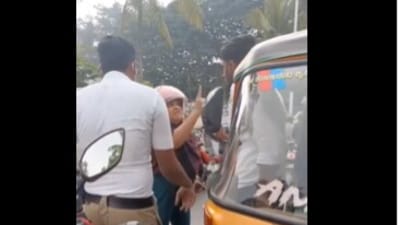 The clip shows a woman on a two-wheeler riding against the flow of traffic before colliding head-on with an autorickshaw. (X/@sanatan_kannada)