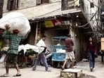 A citizen steps out from one of the lanes intersecting at the crossroad, walks up to the platform, and bends down, reverently laying his right palm on the platform. “Mata ki Chowki,” he explains, turning towards Chawri Bazar. (HT Photo)