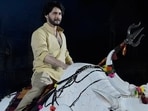 Mahesh Babu rides a mechanical bull at the unveiling of the first look of the film Varanasi in Hyderabad.(AP)
