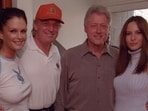 Donald Trump pictured with Bill Clinton in 2000, with Melania standing next to the former president. 