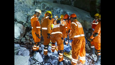 NDRF personnel conduct a rescue operation after a portion of a stone quarry collapsed, in Sonbhadra (PTI) NDRF personnel conduct a rescue operation after a portion of a stone quarry collapsed, in Sonbhadra (PTI)
