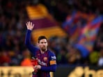 Barcelona forward Lionel Messi waves at the crowd.