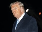 US President Donald Trump walks on the South Lawn of the White House.