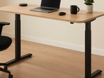 A height-adjustable desk that helps you switch positions with ease and bring more balance into long work hours.(AI generated)