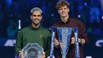 Spain's Carlos Alcaraz, left, and winner Italy's Jannik Sinner stand on the podium after the final tennis match of the ATP World Tour Finals. (AP) Spain's Carlos Alcaraz, left, and winner Italy's Jannik Sinner stand on the podium after the final tennis match of the ATP World Tour Finals. (AP)