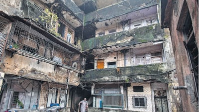 Mumbai, India - July 08, 2022: 25 buildings that once housed 1,200 families at Guru Tegh Bahadur (GTB) Nagar in Sion-Koliwada will be razed to the ground starting Monday. Harneet Kaur Narula, lone resident of the dilapidated Prithvi Punjab CHS building no. 25, stays with her parents without electricity and water supply cut by BMC in spite of the structure being declared dangerous and unsafe, at Punjabi Colony, Guru Tegh Bahadur Nagar, at Sion Koliwada, in Mumbai, India, on Friday, July 08, 2022. (Photo by Satish Bate/Hindustan Times) (Satish Bate/HT PHOTO) Mumbai, India - July 08, 2022: 25 buildings that once housed 1,200 families at Guru Tegh Bahadur (GTB) Nagar in Sion-Koliwada will be razed to the ground starting Monday. Harneet Kaur Narula, lone resident of the dilapidated Prithvi Punjab CHS building no. 25, stays with her parents without electricity and water supply cut by BMC in spite of the structure being declared dangerous and unsafe, at Punjabi Colony, Guru Tegh Bahadur Nagar, at Sion Koliwada, in Mumbai, India, on Friday, July 08, 2022. (Photo by Satish Bate/Hindustan Times) (Satish Bate/HT PHOTO)