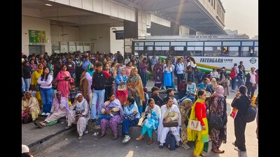 People wait for buses at the New Bus Terminal, in Patiala on Monday. (PTI)
