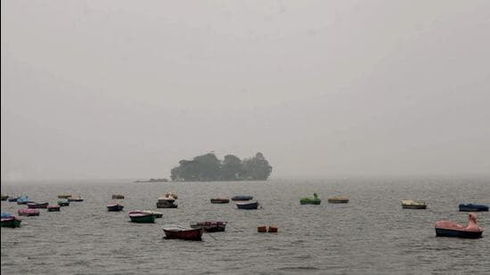 Boats on a hazy morning at the upper lake in Bhopal. (ANI)