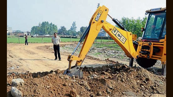 Unauthorised construction in a colony being razed during the demolition drive in Panchkula. (HT Photo)