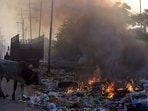 Garbage burns along South Side GT Road in the Industrial Area near Vijay Nagar, sending up black smoke and adding to rising pollution levels in Ghaziabad,