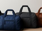 A neat line-up of carry-on duffel bags that keep short trips simple, organised and pleasing to carry.(Ai Generated)