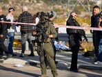 Israeli security forces secure the area of a ramming and stabbing attack near the West Bank Jewish settlement of Gush Etzion, Tuesday. Israeli security forces secure the area of a ramming and stabbing attack near the West Bank Jewish settlement of Gush Etzion, Tuesday.