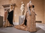 "Bustle" by Charles James, right, is displayed at the announcement, at the Metropolitan Museum of Art, in New York, Monday, Nov. 17, 2025, about the next spring fashion exhibit "Costume Art," which is set to launch at the Met Gala in 2026. (AP Photo/Richard Drew)