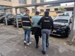 Ecuadorean Wilmer Chavarria being detained Sunday by Spain’s national police.