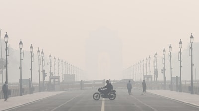 New Delhi, Nov 18 (ANI): A man rides his motorcycle at Kartavya Path amid dense smog as the air quality remains poor, in New Delhi on Tuesday. (ANI Photo/Ankit Tyagi) (Ankit Tyagi) New Delhi, Nov 18 (ANI): A man rides his motorcycle at Kartavya Path amid dense smog as the air quality remains poor, in New Delhi on Tuesday. (ANI Photo/Ankit Tyagi) (Ankit Tyagi)