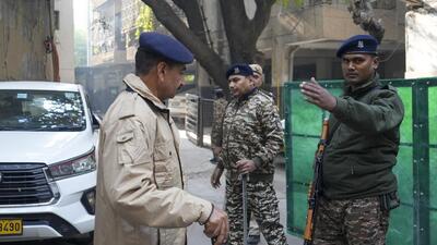 New Delhi: Security personnel stand guard after Enforcement Directorate raided the office of Al Falah University in Okhla (PTI) New Delhi: Security personnel stand guard after Enforcement Directorate raided the office of Al Falah University in Okhla (PTI)