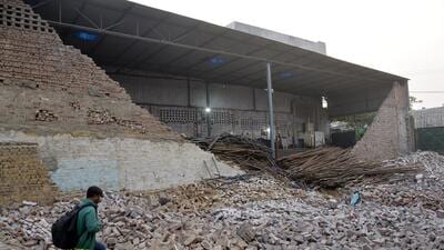 There were five women peeling off the old bricks at a vacant plot. During lunchtime, they all sat near the wall of the warehouse, and it collapsed, said Adil Malik, councillor from ward 90 of Shaheed Nagar. (Sakib Ali/HT Photo) There were five women peeling off the old bricks at a vacant plot. During lunchtime, they all sat near the wall of the warehouse, and it collapsed, said Adil Malik, councillor from ward 90 of Shaheed Nagar. (Sakib Ali/HT Photo)
