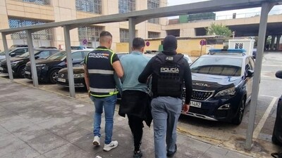 Ecuadorean Wilmer Chavarria being detained Sunday by Spain’s national police.