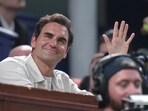 Former tennis player Roger Federer waves to the crowd as he watches the Shanghai Masters final