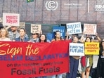 Activists during a demonstration to transition away from fossil fuels, outside the venue for the COP30 Summit on Wednesday. (AP) Activists during a demonstration to transition away from fossil fuels, outside the venue for the COP30 Summit on Wednesday. (AP)
