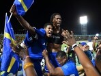 Curacao players and fans celebrate World Cup 2026 qualification after a 0-0 draw with Jamaica