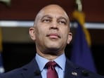 US Minority Leader Hakeem Jeffries speaks to reporters at a news conference inside the US Capitol.