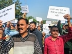 People protest against state cooperative agriculture and rural development bank for withholding matured fixed deposits, in Jammu on Tuesday. (ANI)