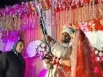 Sahil Bhardwaj, the groom and kickboxing champion, allegedly fired two rounds with Annu Rani, exchanged garlands, and tossed bundles of  <span class='webrupee'>₹</span>10 notes. (Sourced)