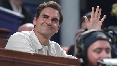 Former tennis player Roger Federer waves to the crowd as he watches the Shanghai Masters final (AP) Former tennis player Roger Federer waves to the crowd as he watches the Shanghai Masters final (AP)