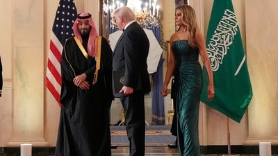 President Donald Trump, first lady Melania Trump and Saudi Arabia's Crown Prince Mohammed bin Salman arrive through the Blue Room for a dinner in the East Room of the White House, Tuesday, Nov. 18, 2025, in Washington. AP/PTI(AP11_19_2025_000003B) (AP) President Donald Trump, first lady Melania Trump and Saudi Arabia's Crown Prince Mohammed bin Salman arrive through the Blue Room for a dinner in the East Room of the White House, Tuesday, Nov. 18, 2025, in Washington. AP/PTI(AP11_19_2025_000003B) (AP)