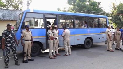 Police personnel stand beside a vehicle after arresting Maoists from Eluru and New Auto Nagar in Gannavaram, Vijayawada. (PTI) Police personnel stand beside a vehicle after arresting Maoists from Eluru and New Auto Nagar in Gannavaram, Vijayawada. (PTI)