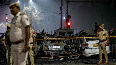 Police inspect charred vehicles as they codorn off the blast site after an explosion near the Red Fort in Delhi. (Sajjad Hussain/AFP) Police inspect charred vehicles as they codorn off the blast site after an explosion near the Red Fort in Delhi. (Sajjad Hussain/AFP)