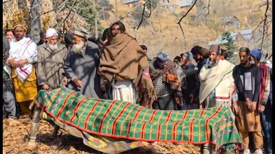 People gather around the mortal remains of Delhi blast victim Bilal Sangoo during his funeral, in Kangan, Ganderbal, Jammu and Kashmir, on Wednesday. (PTI)