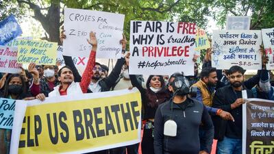 People stage a protest against rising air pollution in New Delhi. (ANI) People stage a protest against rising air pollution in New Delhi. (ANI)