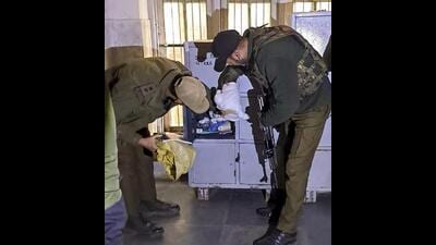 Security personnel inspect lockers at a hospital in Kulgam on Wednesday. (PTI) Security personnel inspect lockers at a hospital in Kulgam on Wednesday. (PTI)